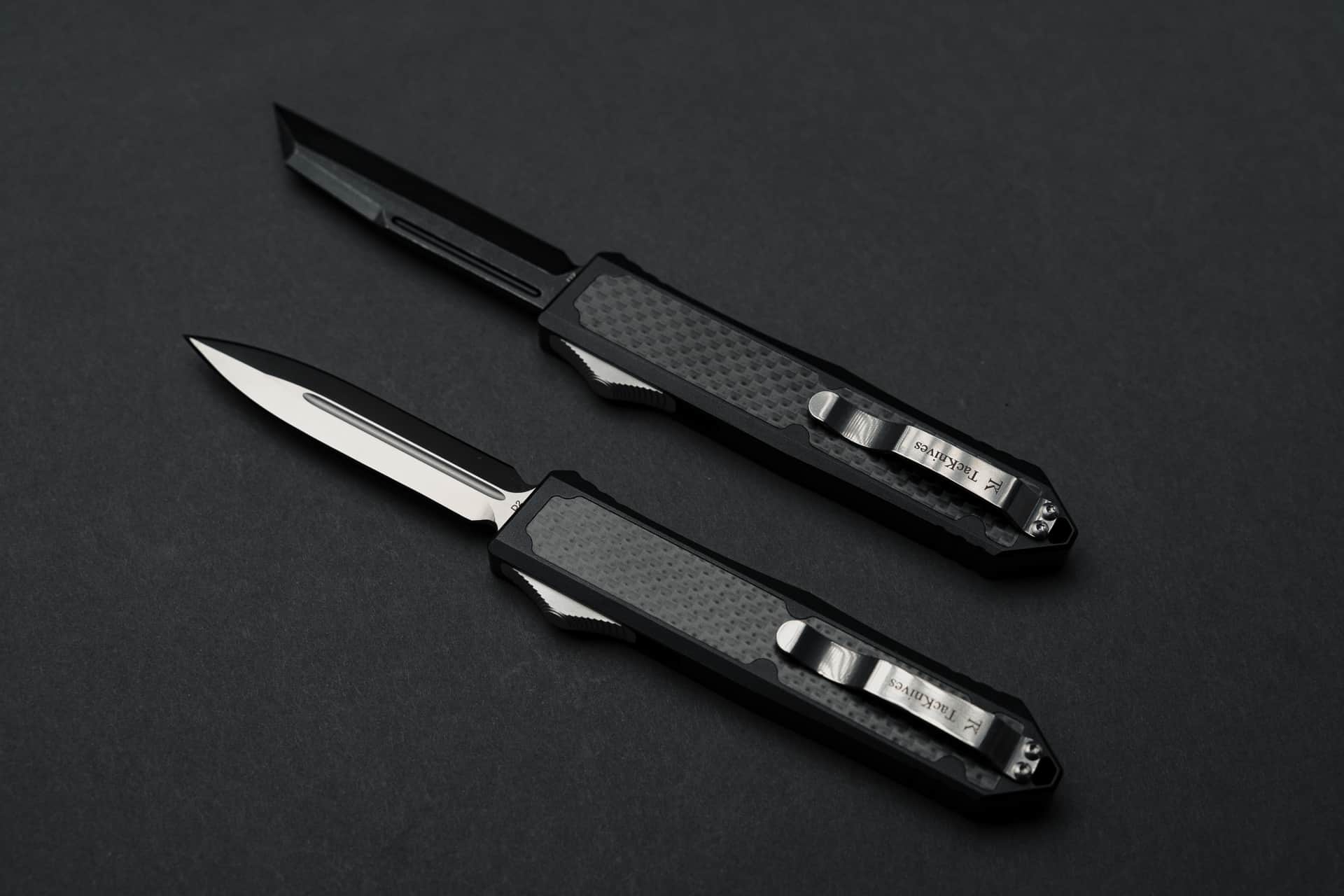 Pocket clip side of 2 Takcom Barracuda premium OTF knives